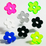 five-petal flowers with a perfectly round hole in the center, set against a transparent background. The flower design is simple, modern, and symmetrical, with soft, rounded edges that make it ideal for use as a laser-cut acrylic charm or pendant.